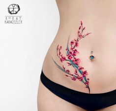 a woman's stomach with pink flowers on it and the words instagramm written in