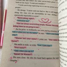 an open book with writing on it and two pink pens next to each other in front of the page