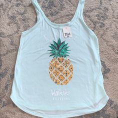 Billabong Waikiki Pineapple Tank Top, Women’s, Md. Nwt! Casual Tops With Tropical Print For Poolside, Casual Tropical Print Tops For Poolside, Fun Blue Tank Top For Summer, Casual Printed Tank Top For Beach, Casual Printed Tank Top For The Beach, Cute Blue Tank Top For Beach, Casual Tank Top For Vacation, Summer Beach Tops With Fruit Print, Summer Fruit Print Tops For Beach