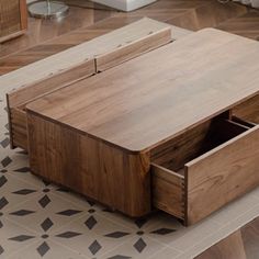 a coffee table with drawers on top of it in the middle of a living room