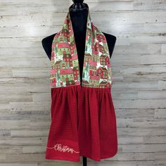 a red and green scarf on a mannequin