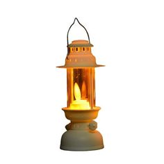 an old fashioned lantern is lit up on a white background