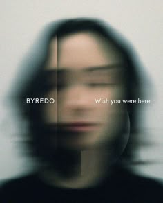 a blurry photo of a man's face with the words byredo on it