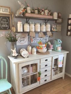 an old dresser is decorated with jars and other items for the home office or dining room