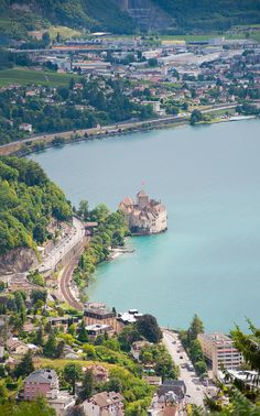 an aerial view of a town and lake