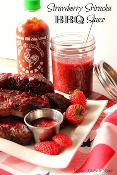 strawberry sriracha bbq sauce on a plate with grilled ribs and strawberries