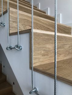 the stair railings are made from wood and metal