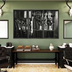 three black and white pictures hanging on the wall above a table with scissors in it