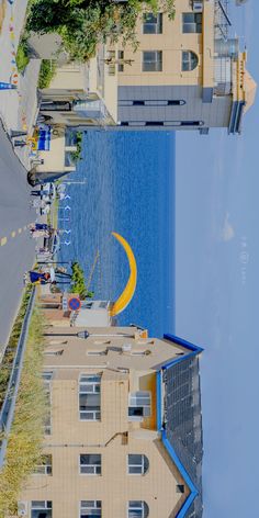 an upside down view of some buildings and water