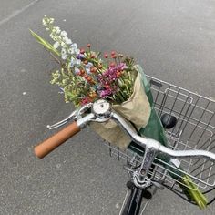 a bicycle with flowers in the handlebars