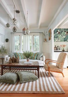 a living room filled with furniture and decor