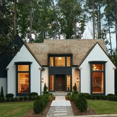 a white house with black trim and windows