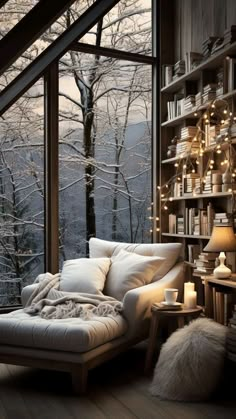 a living room filled with furniture next to a window covered in lights and bookshelves