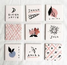 six ceramic coasters with different designs on them