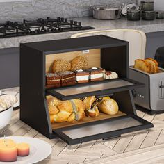 an assortment of breads and pastries are displayed in a display case on the kitchen counter