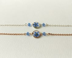 Dainty pressed flower bracelet or anklet with real blue Forget me not. Delicate bracelet with 10mm clear resin round charm and blue crystal beads. This bracelet is available in four metals - sterling silver, rose gold plated, yellow gold plated and stainless steel. Something blue for bride. Wonderful keepsake gift to give to friends, bridesmaids or yourself. Forget me not - a flower of loyalty, a symbol of eternal love, sympathy, and light remembrance, making them the perfect flower to give on t Dainty Resin Jewelry, Something Blue Bracelet, Cute Blue Flower Jewelry, Blue Flower-shaped Dainty Jewelry, Forget Me Not Bracelet, Forget Me Not Jewelry, Delicate Blue Jewelry With Pressed Flowers, Not Bracelet, Something Blue For Bride