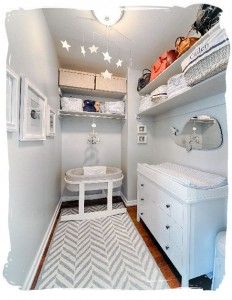 a baby's room is shown with white furniture and shelves on either side of the closet