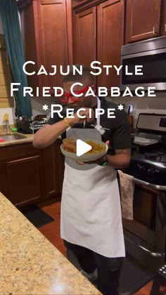 a man in an apron holding a plate with food on it and the words cajunstyle fried cabbage recipe