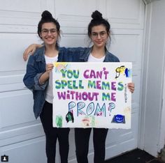 two girls holding a sign that says you can't spell mes without me from?