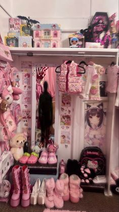 a room filled with lots of stuffed animals and pink shoes on the floor next to shelves