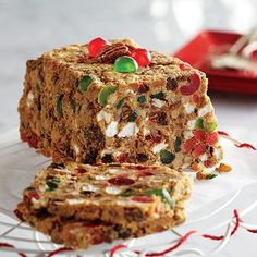 two pieces of cake sitting on top of a glass plate next to another piece of food