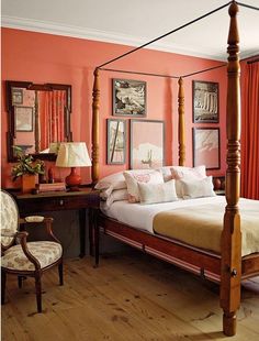 a bedroom with pink walls and white bedding