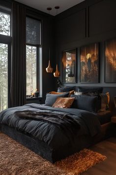 a bedroom with black walls and wooden flooring, large window overlooking the forest is lit by two lamps on either side of the bed