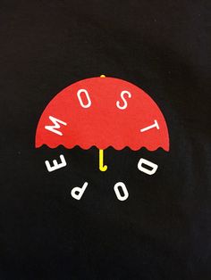 a red umbrella with the words som and do something written underneath it on a black t - shirt