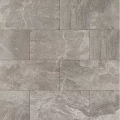 a tile floor with grey and white colors