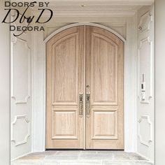 two wooden doors are shown in front of a white wall and stone floored entry way