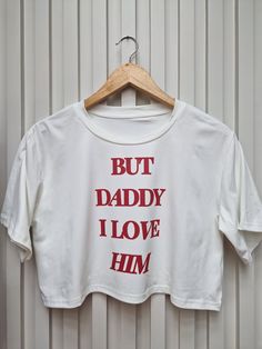 But Daddy I Love Him t-shirt. Perfect for attending the Era's tour or for casual wear. Round Neck Crop Short Sleeves Drop Shoulder Comfy Tee. Summer Concert T-shirt With Letter Print, Summer Concert T-shirt With Logo Print, Logo Print T-shirt For Summer Concerts, Summer Band Merch Cropped T-shirt With Graphic Print, Cotton Band Merch Tops With Letter Print, Summer Concert Tops With Logo Print, Cotton Tops With Letter Print Band Merch, Band Merch Tops With Funny Print For Concerts, Band Merch Top With Funny Print For Concert