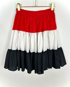 Vintage 1980's Square Dancing Country Western Skirt * A-Line Circle Style * Tiered Ruffled in Red * Black * White * Cotton * USA * Size M/L * Elastic waist * Promenade Fashions - costume skirt made for square dancing - but it is so fun for every day wear * Tiered fabric in red, white and black with matching blouse available * Labeled as a size medium * Fabric label missing, feels like cotton * Gently pre worn Measurements (flat): Length: 22 in Waist: 13.5-15 in Sourced in Louisiana, USA 🇺🇸 Vintage Tiered Skirt Bottoms For Festival, Red Cotton Ruffle Skirt, Vintage Red Tiered Skirt, Retro Red Cotton Skirt, Retro Red Gathered Skirt, Western Skirts, Louisiana Usa, Square Dancing, Fabric Labels