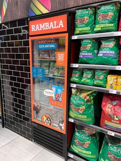 a vending machine for ramblaa in a grocery store with other items on display