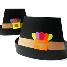 two black hats with colorful decorations on them