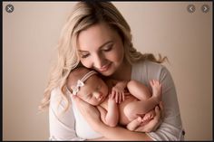 a woman holding a baby in her arms