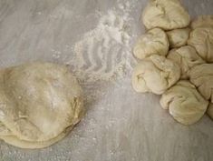 some dough is laying on the table and next to it's kneads