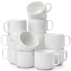 a stack of white coffee mugs sitting next to each other on a white surface