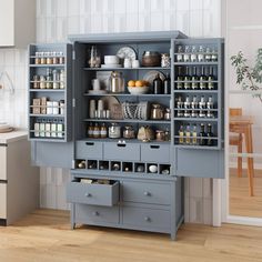 an open cabinet in the middle of a kitchen