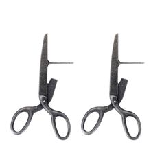 two pairs of scissors are shown against a white background with clippings to the side