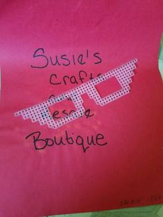 a pink piece of paper with writing on it that says susan's craft expo boutique