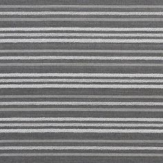 a gray and white rug with vertical stripes