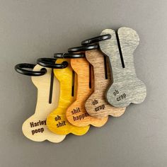 wooden dog bone keychains with engraved sayings on the sides, set of 5