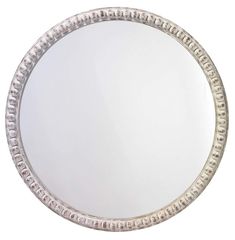 a round mirror with an intricate design on the bottom and sides, is shown against a white background