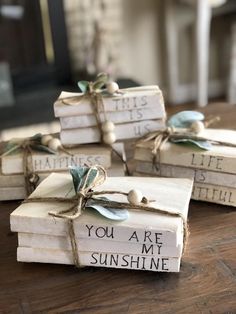 some books that are wrapped in twine and tied with string, sitting on top of a table