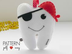 a tooth with a bandana on it is next to gold coins and the caption says pattern