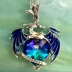 Thanks For Stopping By! While You're Here Please Take A Look At The Other Items In My Shop. Bundle And Save! About This Item: Dragon Pendant With Blue/ Teal / Violet Heart On Silver Tone Adjustable 18-20" Chain Thank You For Looking! Condition: New With Tags Dragon Stuff, Personalized Blue Jewelry, Personalized Blue Metal Jewelry, Blue Personalized Metal Jewelry, Personalized Blue Necklace For Valentine's Day, Personalized Blue Heart Jewelry, Personalized Blue Necklaces For Valentine's Day, Blue Personalized Necklace For Valentine's Day, Personalized Blue Heart Shaped Jewelry