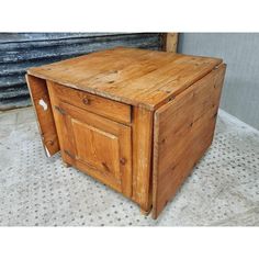 an old wooden box sitting on the floor