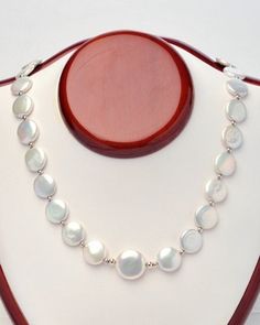 Outstanding, 12mm, white, coin pearl necklace, with a 16mm coin pearl center, surrounded by sterling silver beads.  Sterling silver clasp and a one inch extension chain 17 inches long. For yourself or give as a gift, to be enjoyed by all! Please visit our other Etsy shop: https://www.etsy.com/ca/shop/PearlEarringsEtc Coin Pearl Necklace, South Sea Pearl Necklace, Golden South Sea Pearls, Coin Pearls, South Sea Pearls, Akoya Pearls, One Inch, Freshwater Pearl Necklaces, Sterling Silver Bead