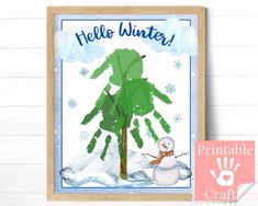 a snowman is standing next to a tree and handprints on the wall