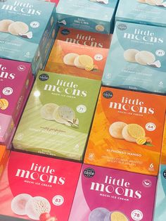 many boxes of little moon's cookies are stacked on top of each other